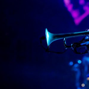 Vibrant image of a trumpeter playing during a live jazz concert, capturing the essence of musical performance.